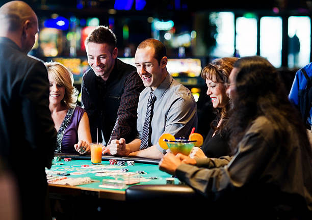 Live dealer managing Ceme Online table with domino cards and betting chips on flaptzy